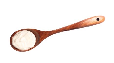 Photo of Wooden spoon with tasty mayonnaise isolated on white, top view