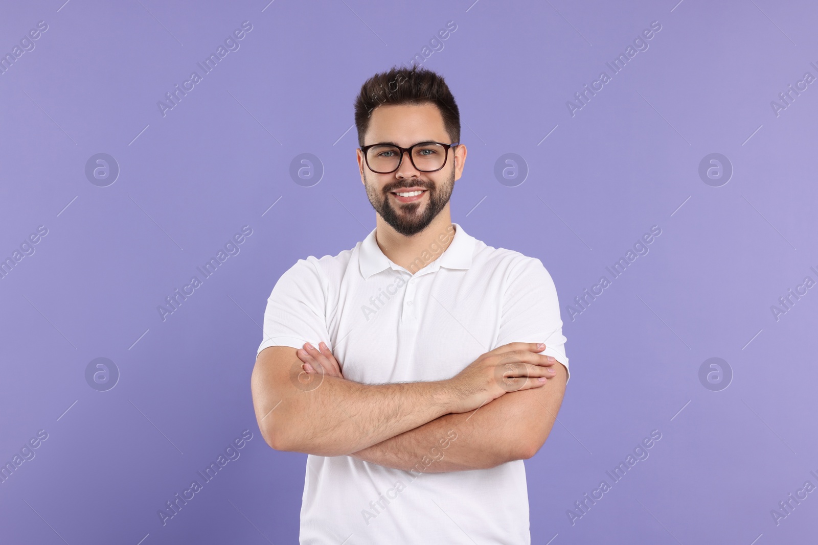 Photo of Handsome man wearing glasses on violet background