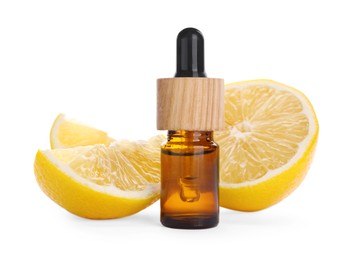 Photo of Bottle of citrus essential oil and cut fresh lemon isolated on white