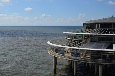 Photo of HAGUE, NETHERLANDS - SEPTEMBER 10, 2022: Beautiful facade of Scheveningen Pier on sunny day