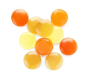 Photo of Many different color cough drops on white background, top view