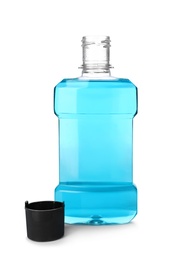 Bottle with mouthwash for teeth care on white background