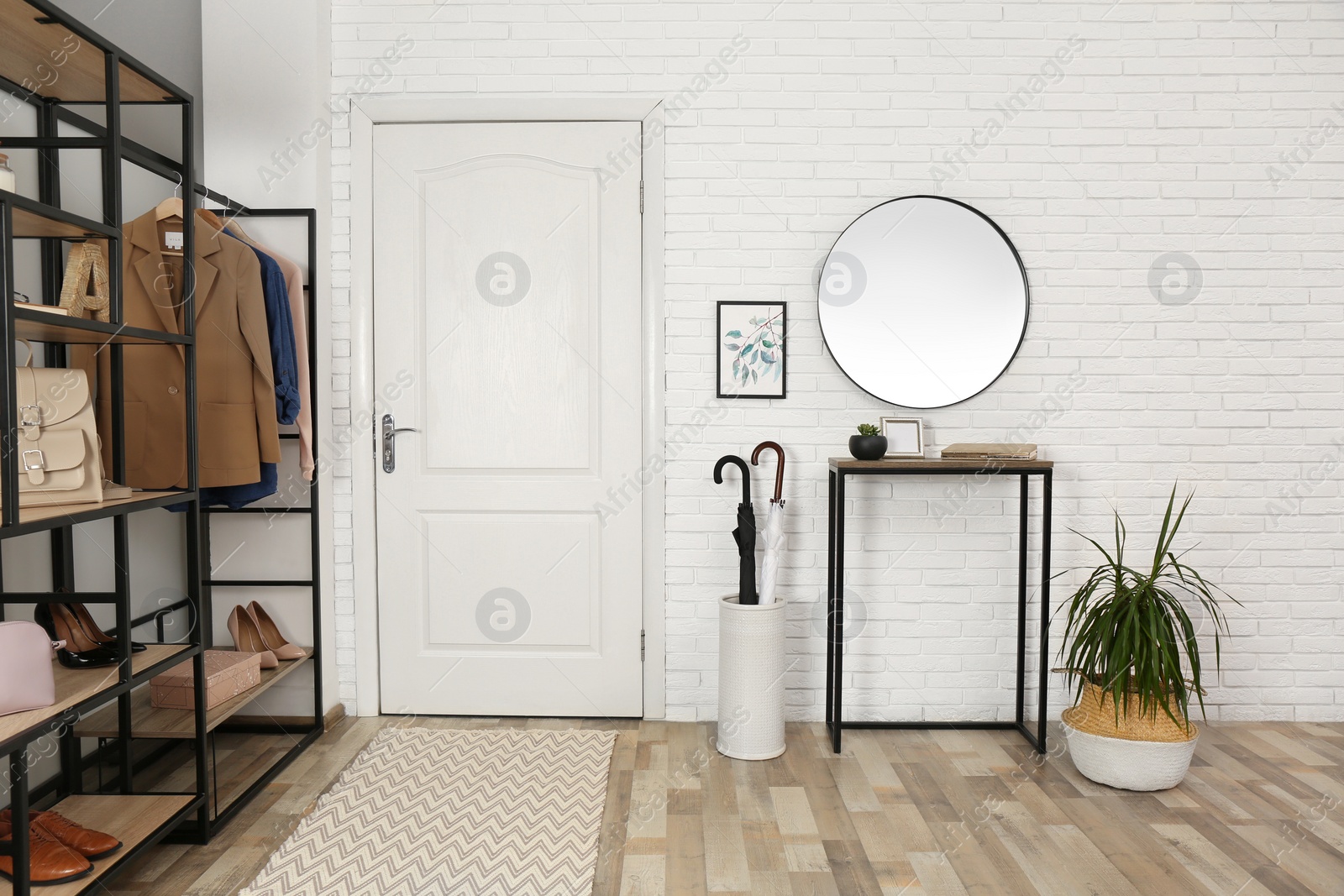 Photo of Modern hallway interior with mirror and storage unit