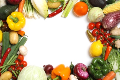 Frame made of different fresh vegetables on white background, top view. Space for text