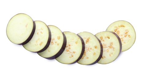 Photo of Slices of ripe eggplant isolated on white, top view