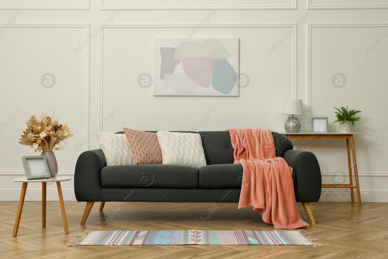 Photo of Beautiful sofa with cushions in living room. Interior design