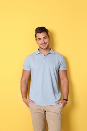 Photo of Portrait of handsome young man on color background