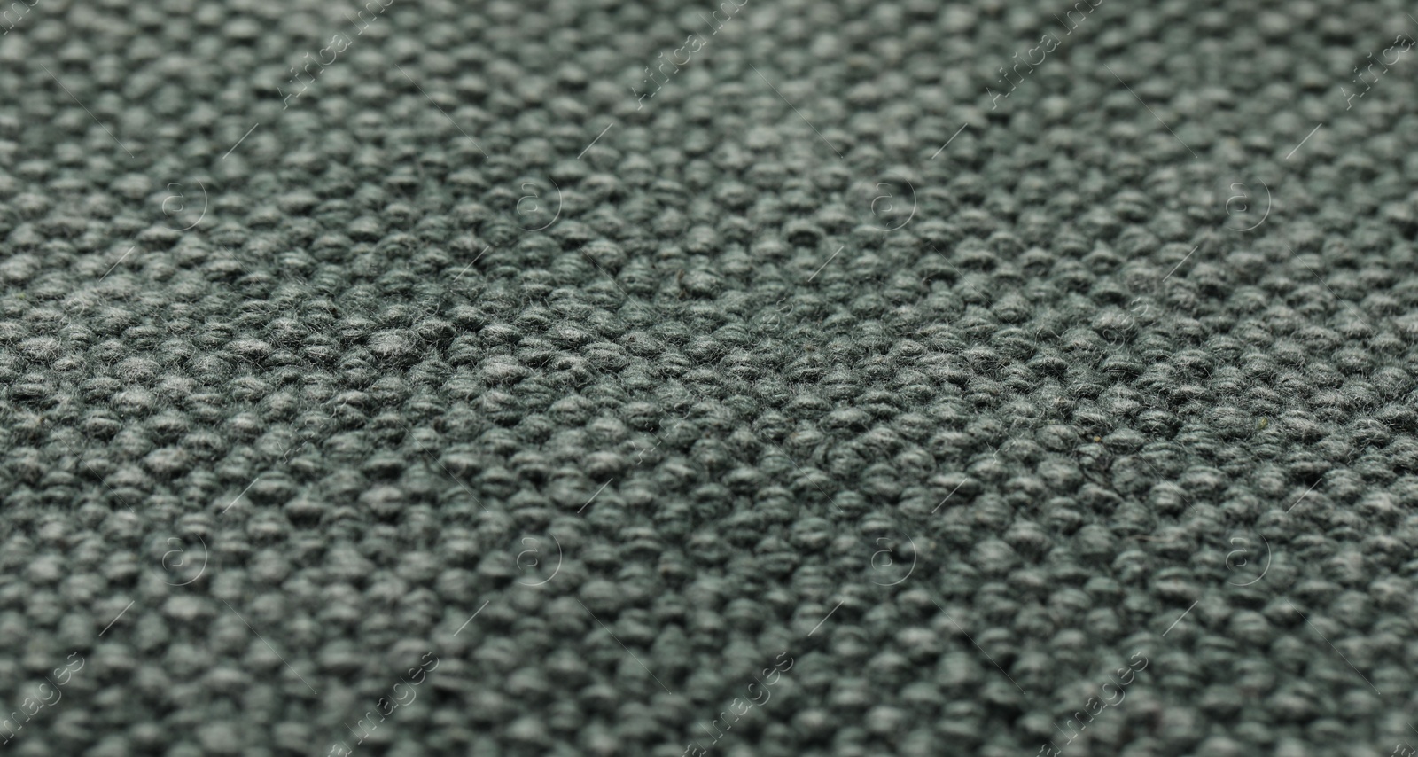 Photo of Texture of soft grey knitted fabric as background, closeup