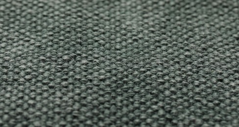 Texture of soft grey knitted fabric as background, closeup