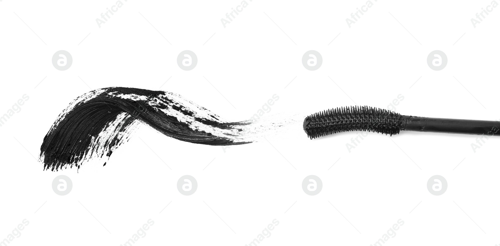 Photo of Applicator and black mascara smear for eyelashes on white background, top view