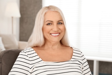 Photo of Portrait of mature woman with beautiful face indoors