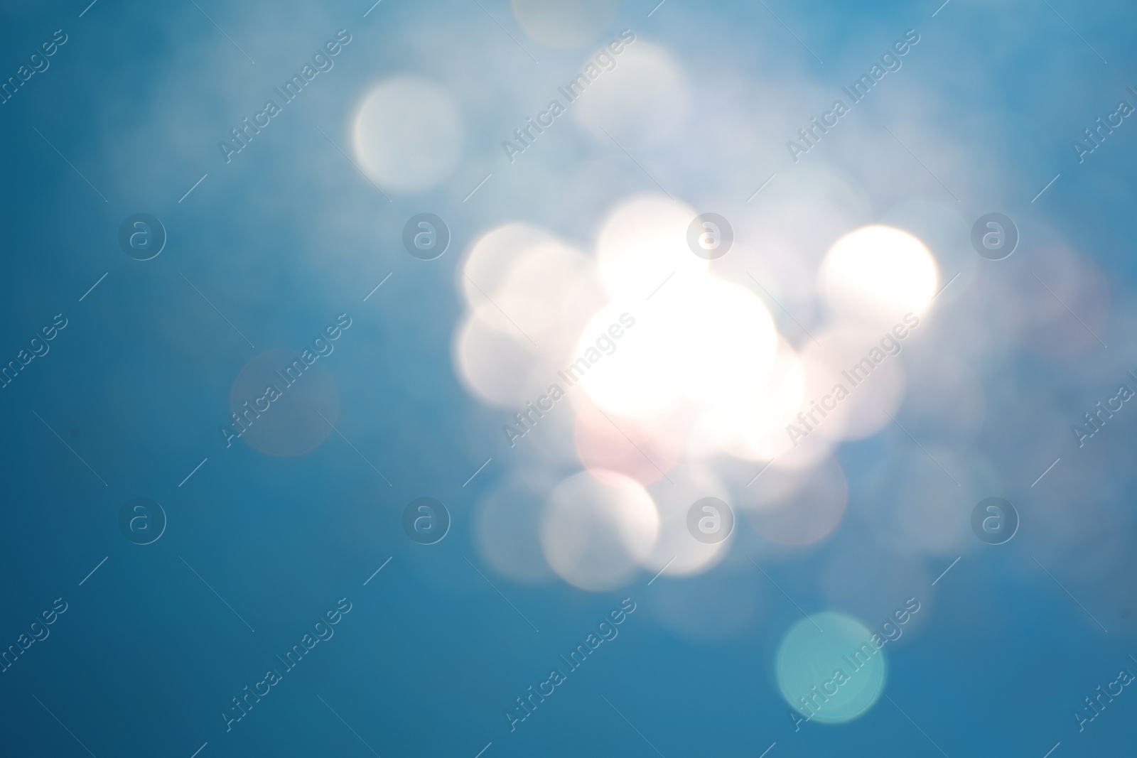 Photo of Shiny turquoise background with magical bokeh effect