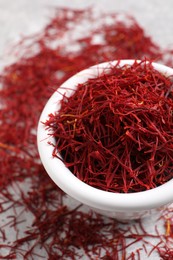 Photo of Aromatic dried saffron on table, closeup view