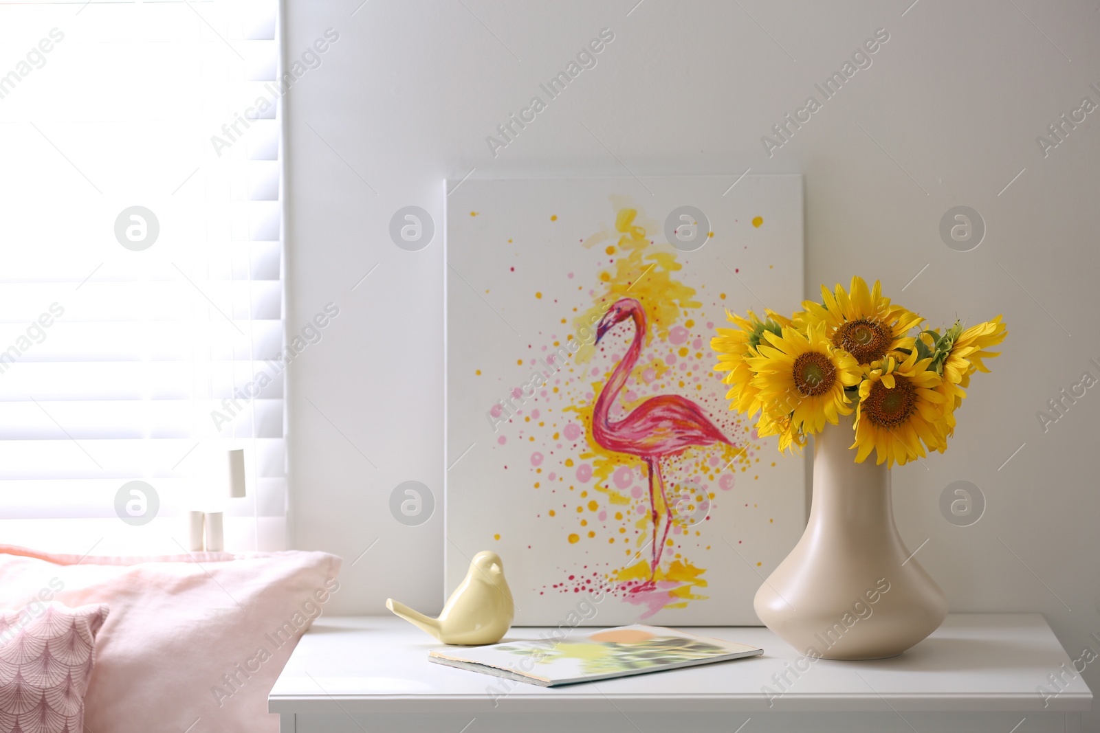 Photo of Beautiful bouquet of sunflowers in vase on white table indoors