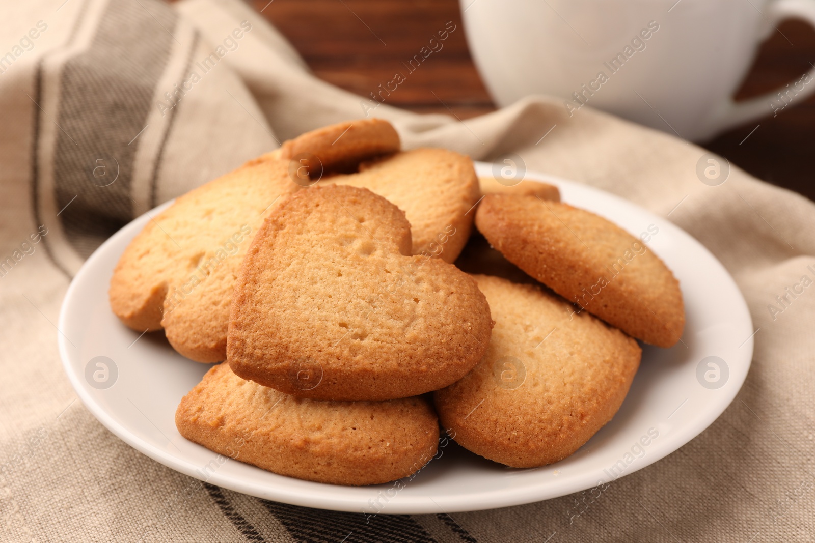 Photo of Heart shaped Danish butter cookies on table, closeup