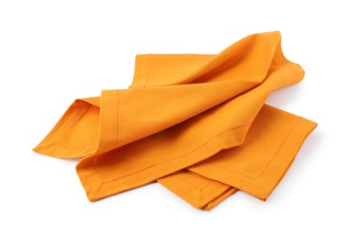 Photo of New clean orange cloth napkins isolated on white