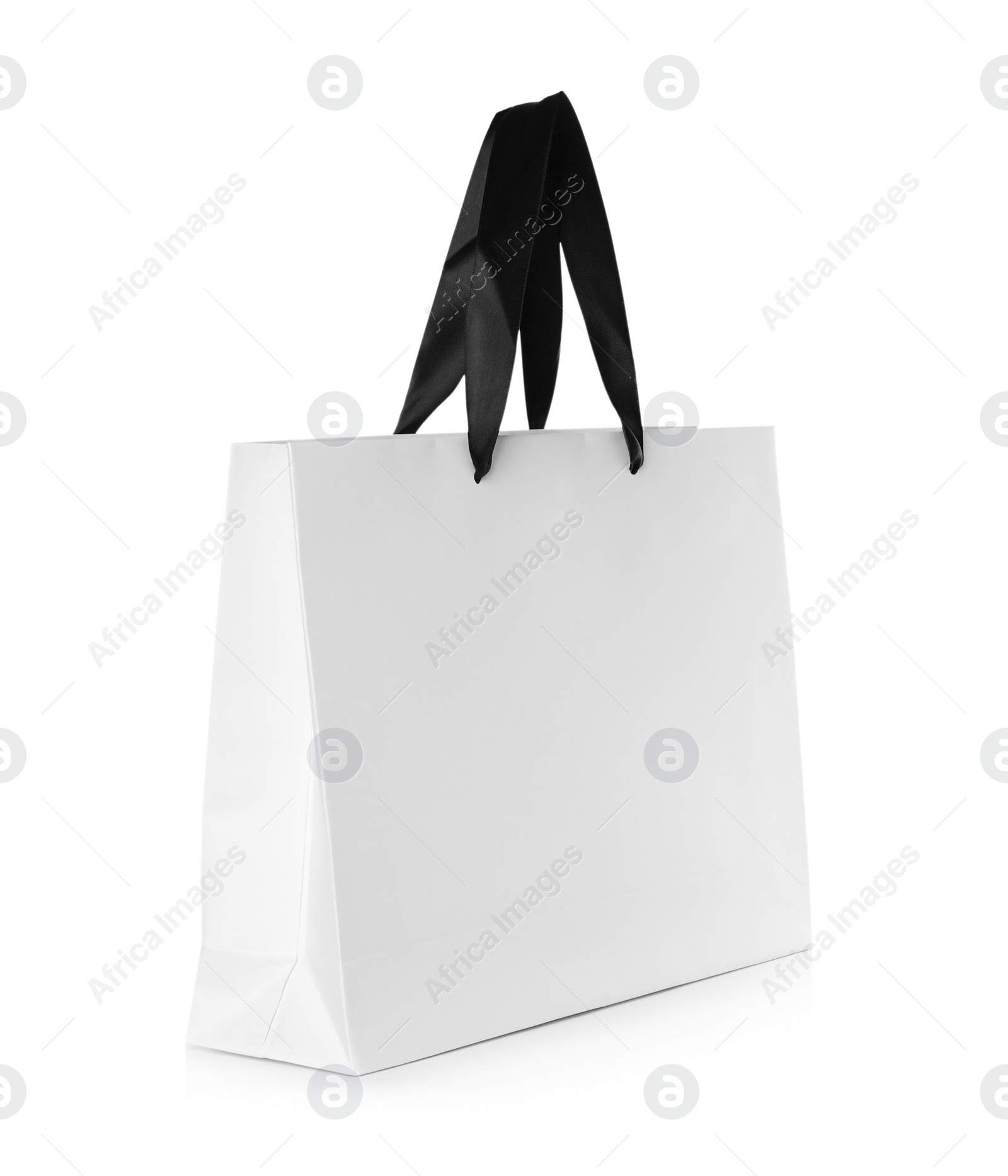 Photo of Paper shopping bag isolated on white. Mock up for design