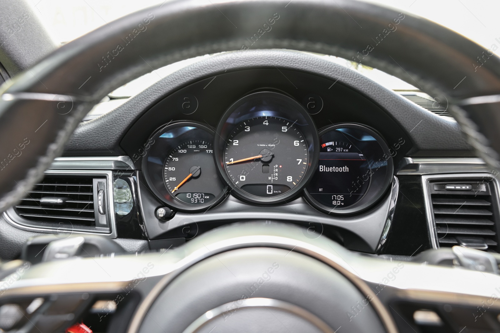 Photo of Speedometer and tachometer inside of modern car, closeup