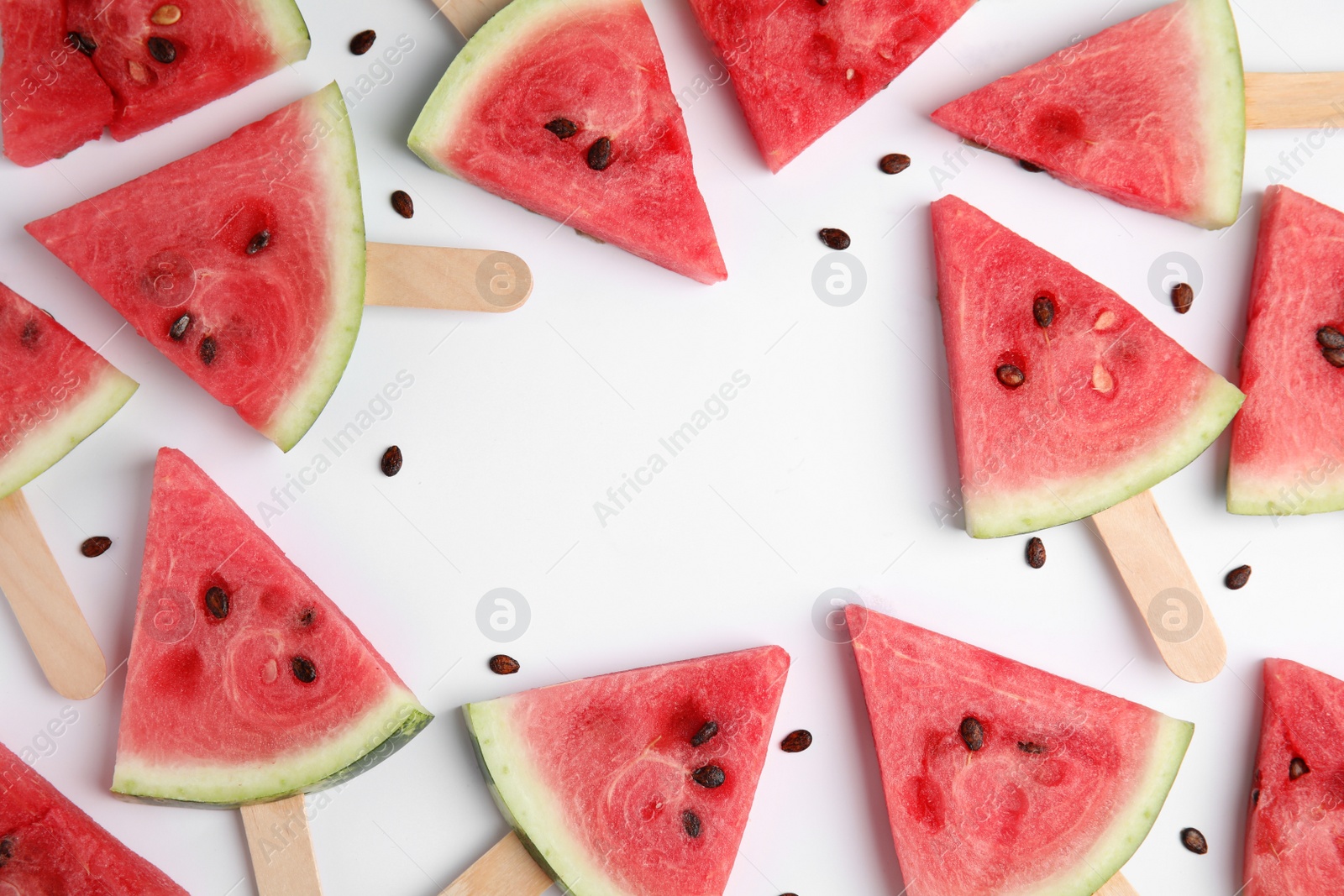 Photo of Frame made with slices of ripe watermelon on white background, flat lay. Space for text