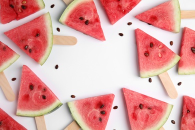 Frame made with slices of ripe watermelon on white background, flat lay. Space for text