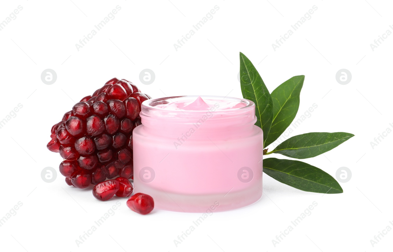 Photo of Glass jar with natural facial mask, pomegranate seeds and green leaves isolated on white