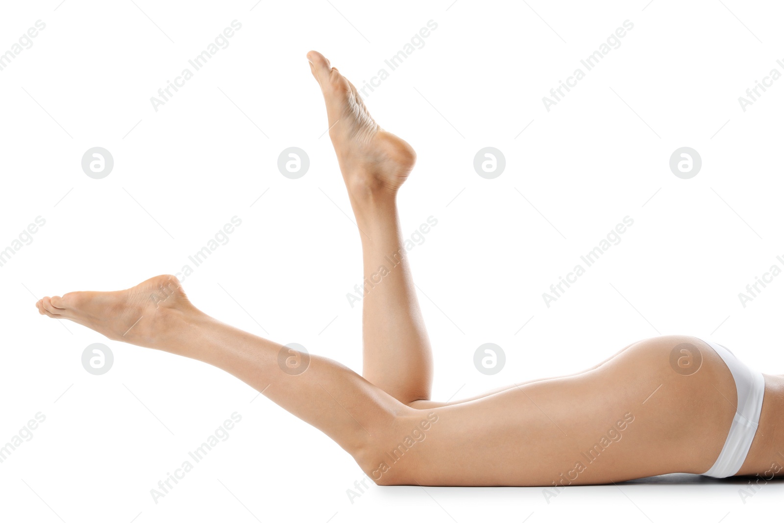 Photo of Young woman with beautiful long legs on white background, closeup