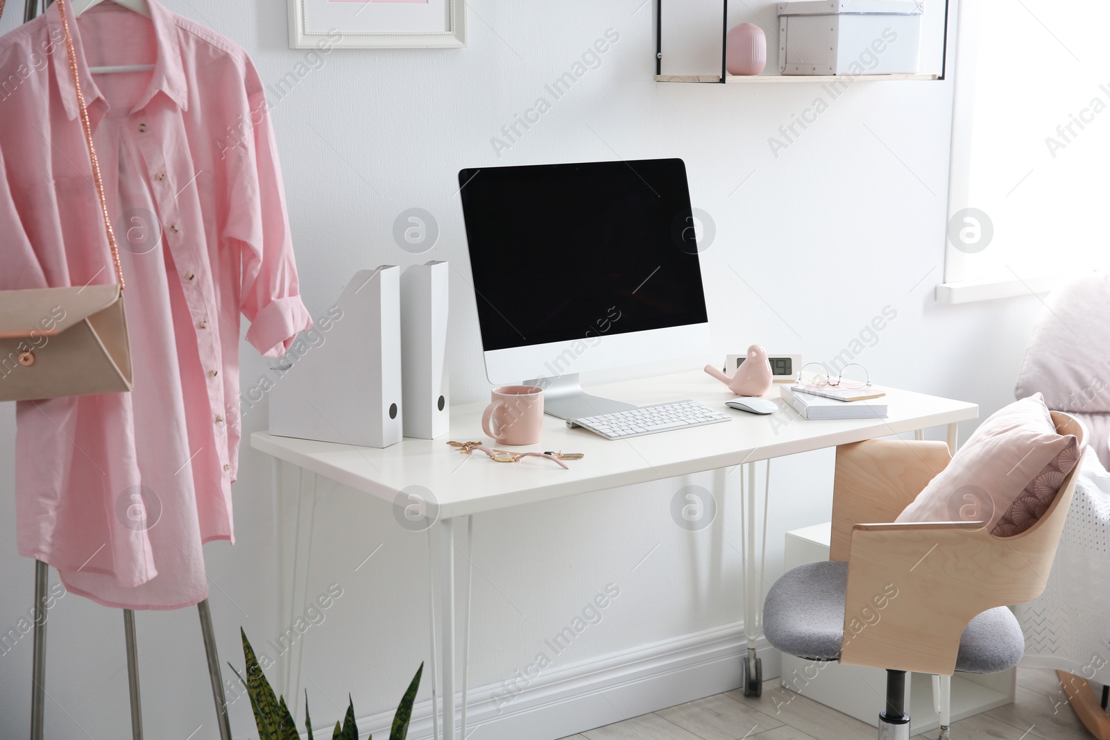 Photo of Comfortable workplace with computer on desk in home office