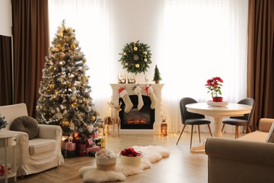 Photo of Beautiful room interior with decorated Christmas tree