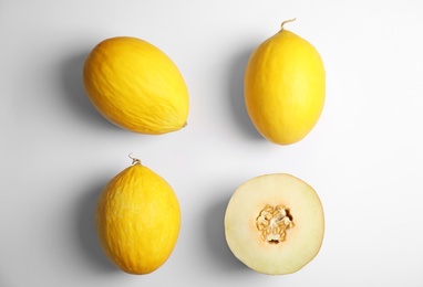 Photo of Flat lay composition with melons on white background