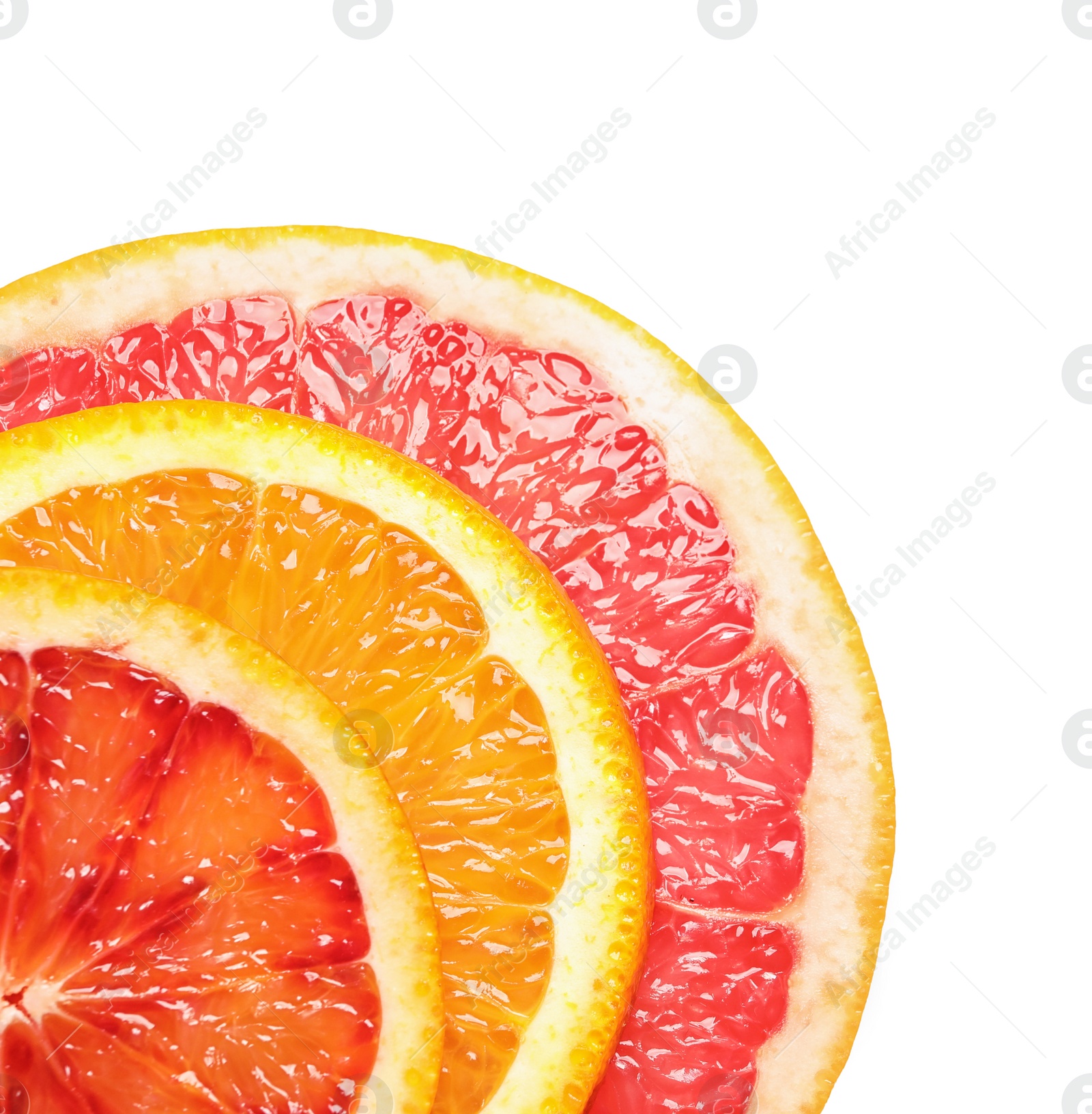 Photo of Slices of fresh citrus fruits on white background, top view