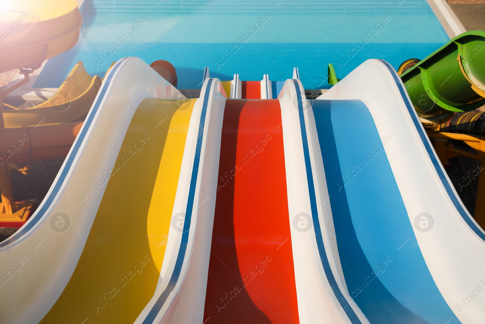 Photo of Colorful slides in water park on sunny day