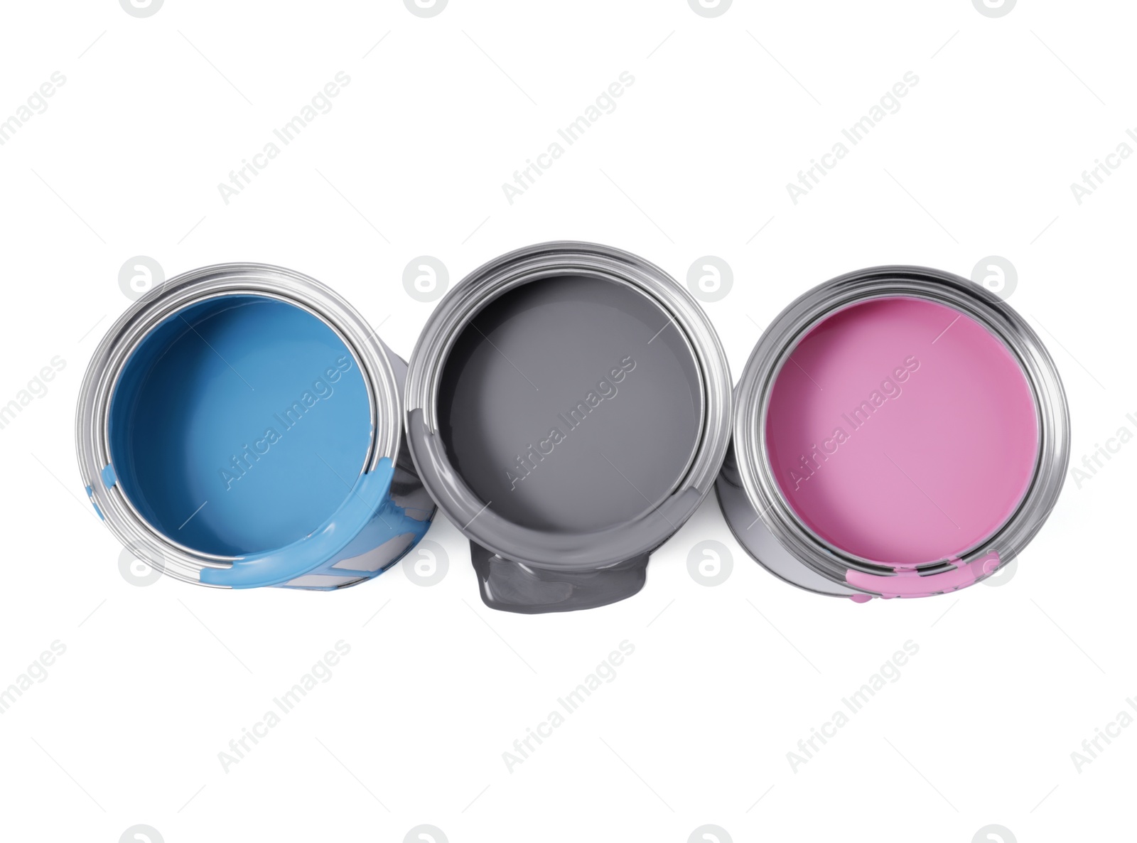 Photo of Cans of grey, light blue and pink paints isolated on white, top view