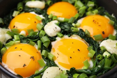 Tasty green Shakshouka in frying pan, closeup