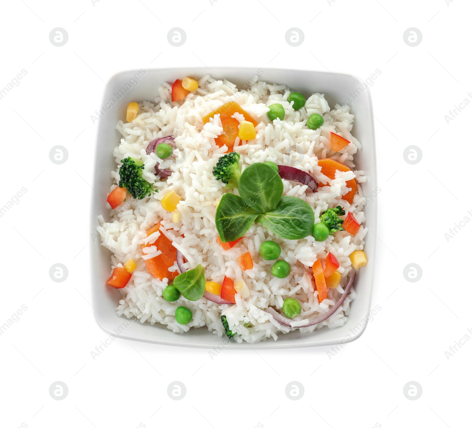 Photo of Bowl with tasty rice and vegetables on white background, top view