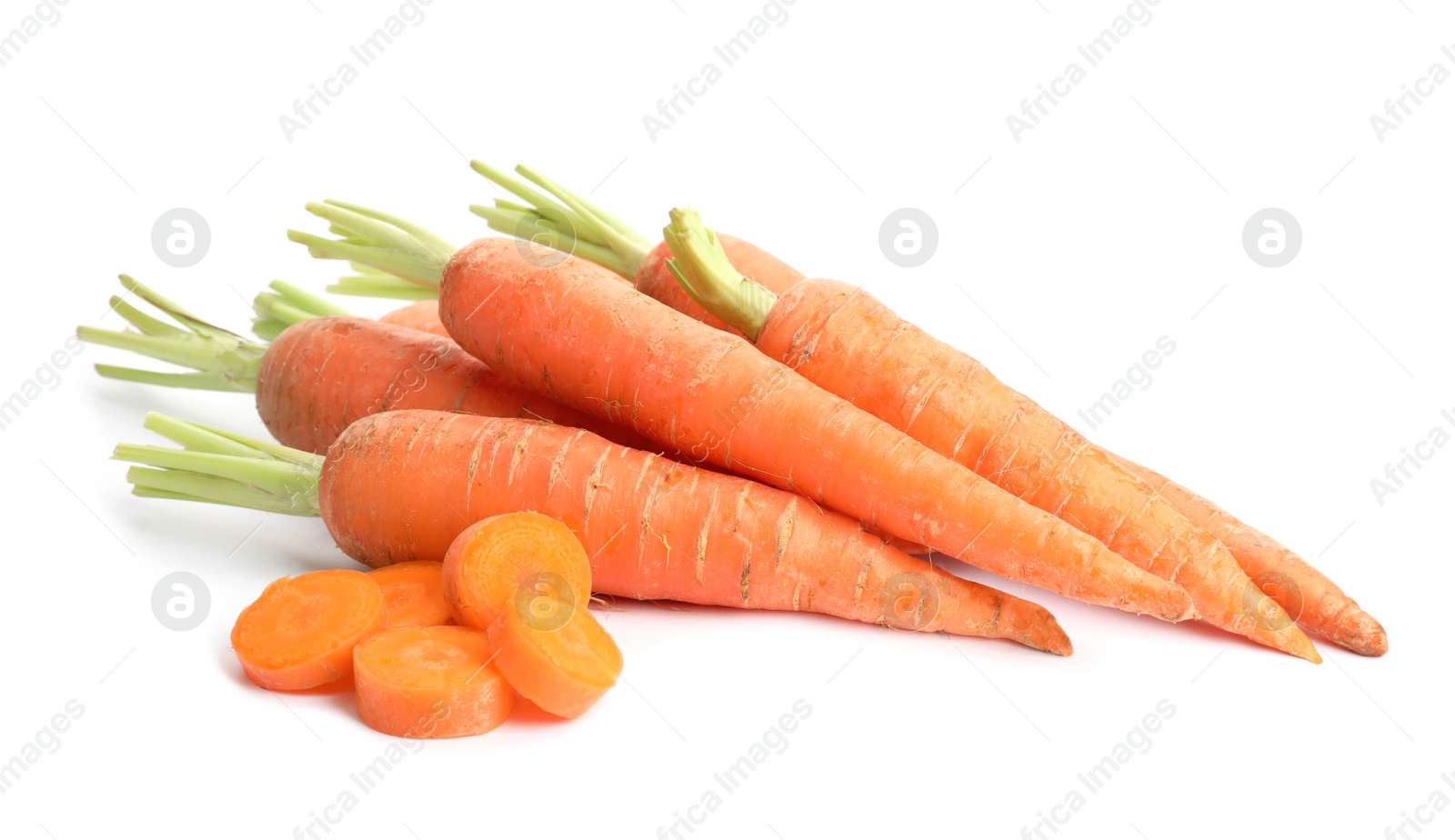 Photo of Whole and sliced ripe carrots on white background