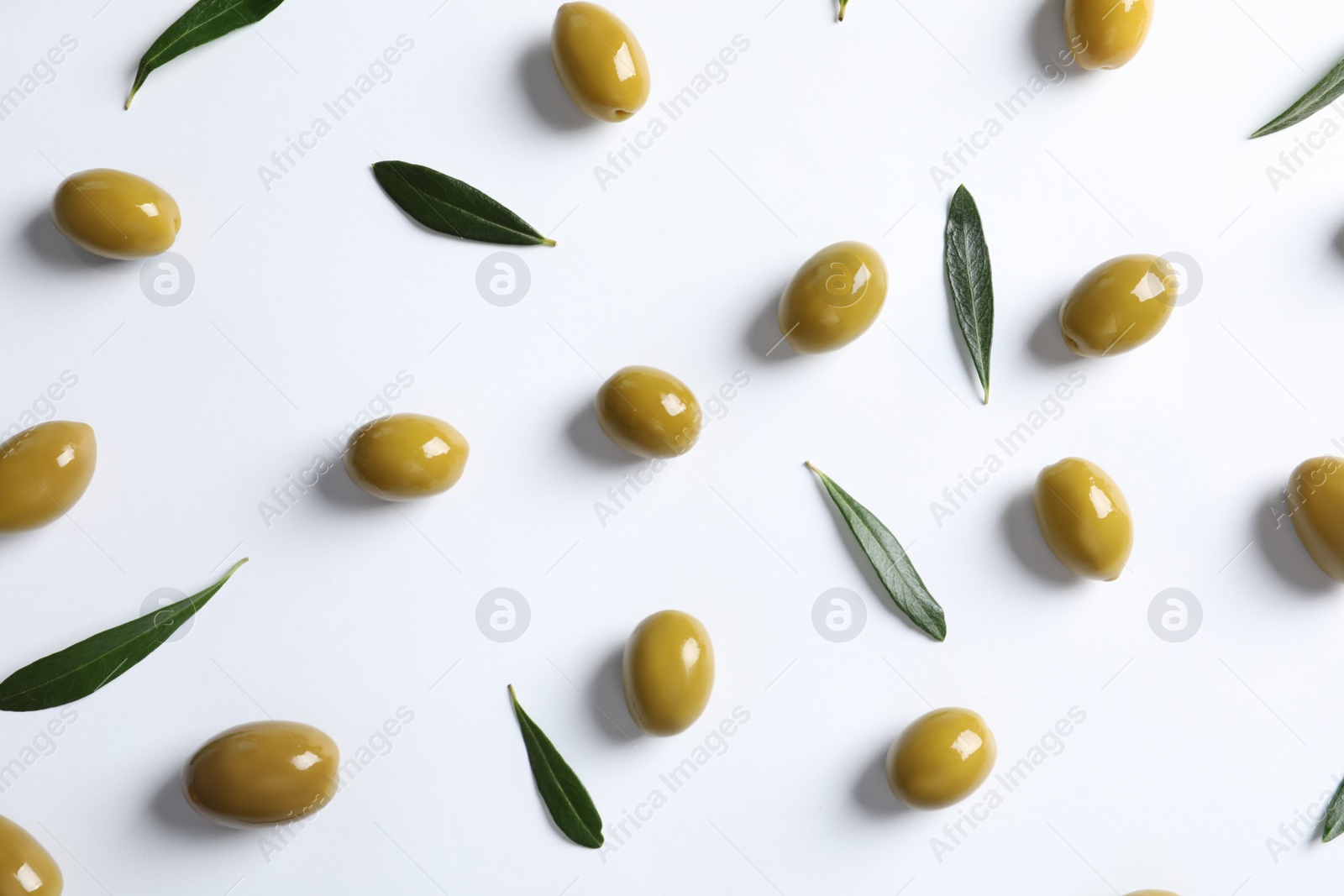 Photo of Flat lay composition with fresh olives covered with oil on white background