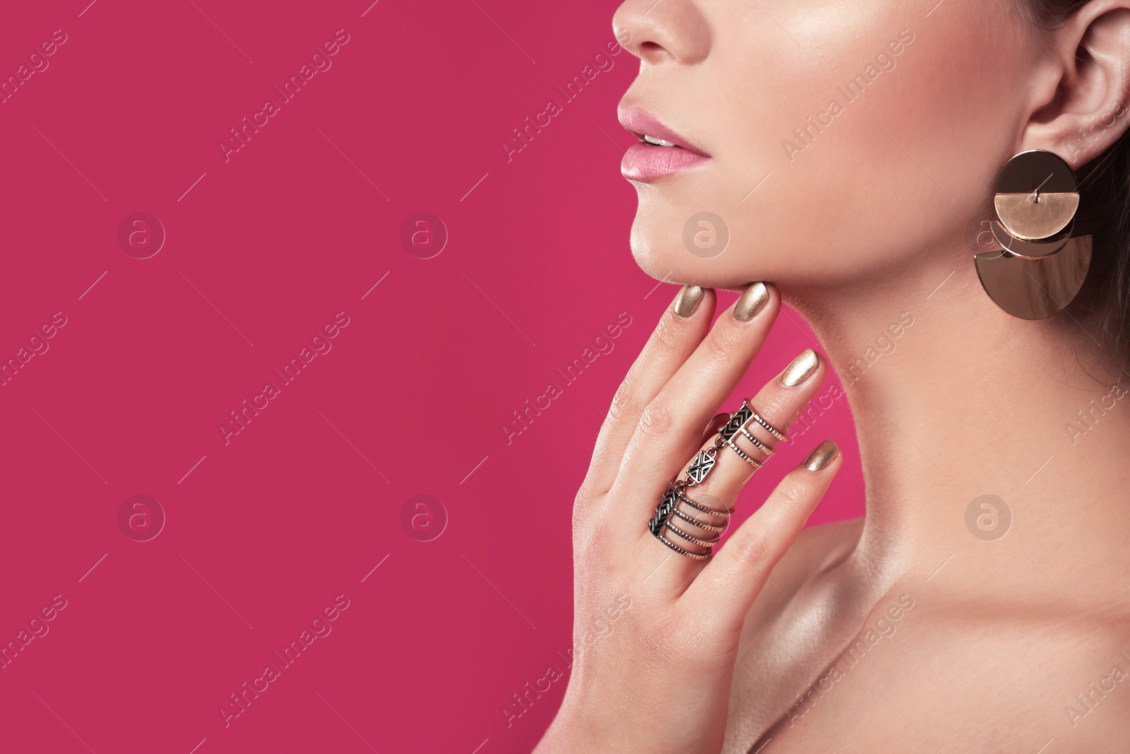 Photo of Beautiful woman with stylish nail polish on color background, closeup. Space for text