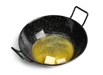 Photo of Frying pan with melting butter on white background