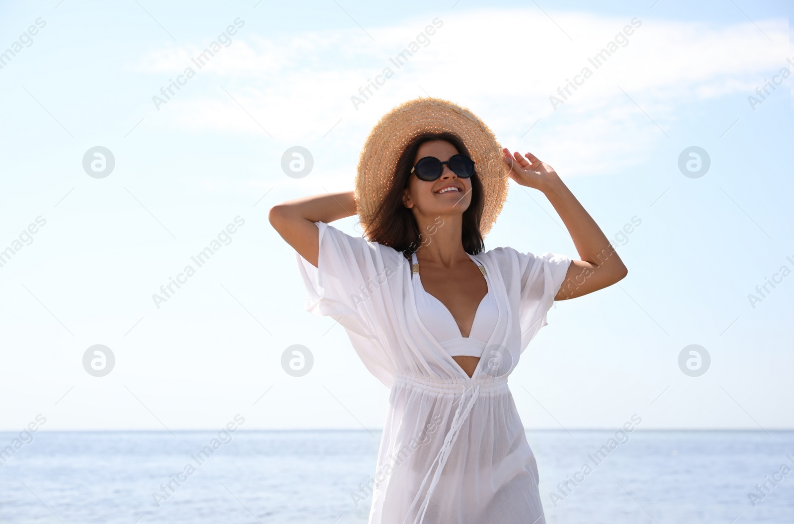 Photo of Young woman with beautiful body on beach