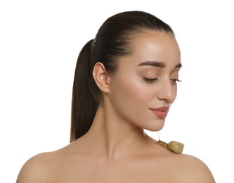 Beautiful young woman with snail on her shoulder against white background