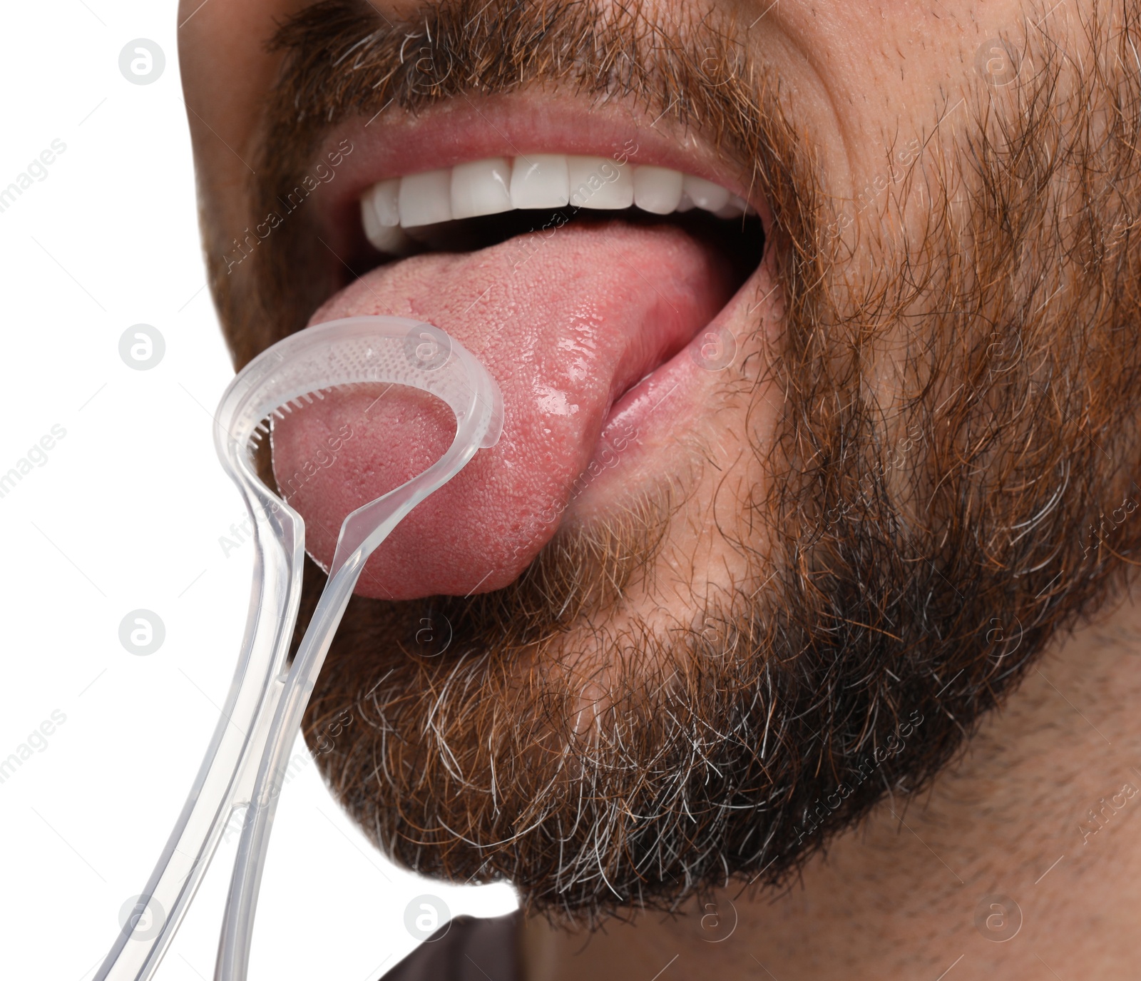 Photo of Man brushing his tongue with cleaner on white background, closeup