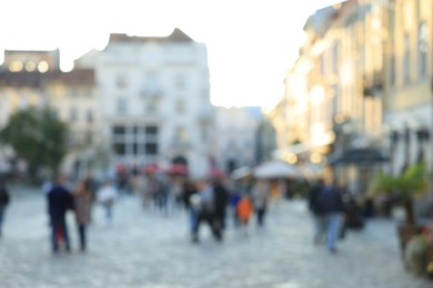 Blurred view of people walking on city street