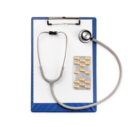 Stethoscope, pills and clipboard isolated on white, top view. Medical tool