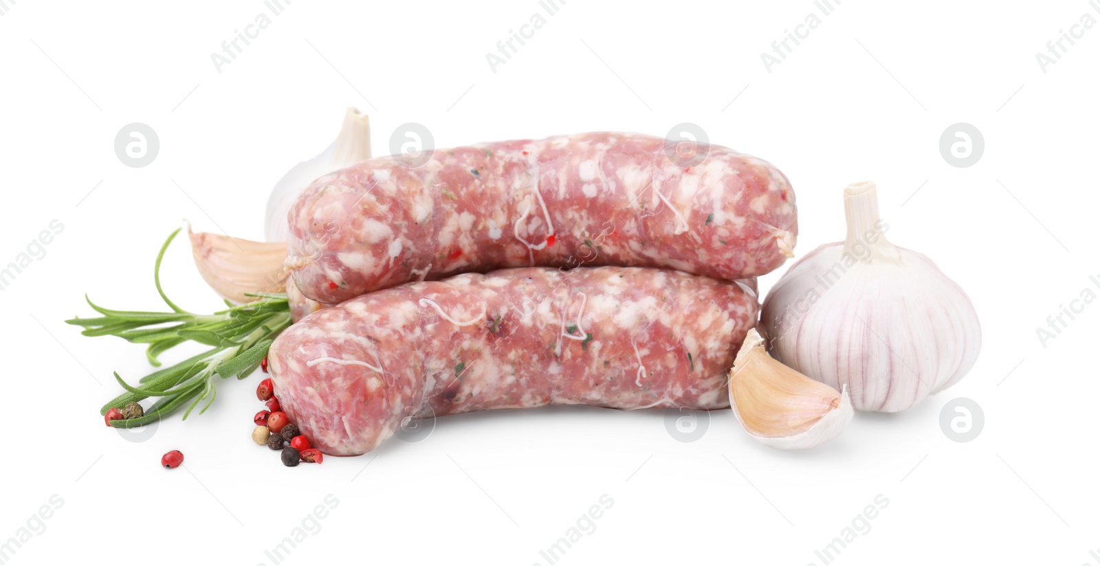 Photo of Raw homemade sausages and different spices isolated on white