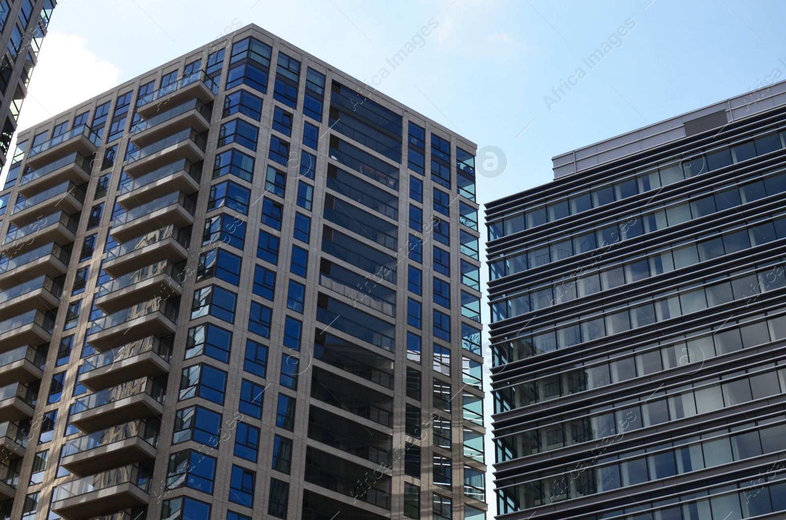 Photo of Exterior of beautiful buildings against blue sky, low angle view