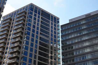 Photo of Exterior of beautiful buildings against blue sky, low angle view