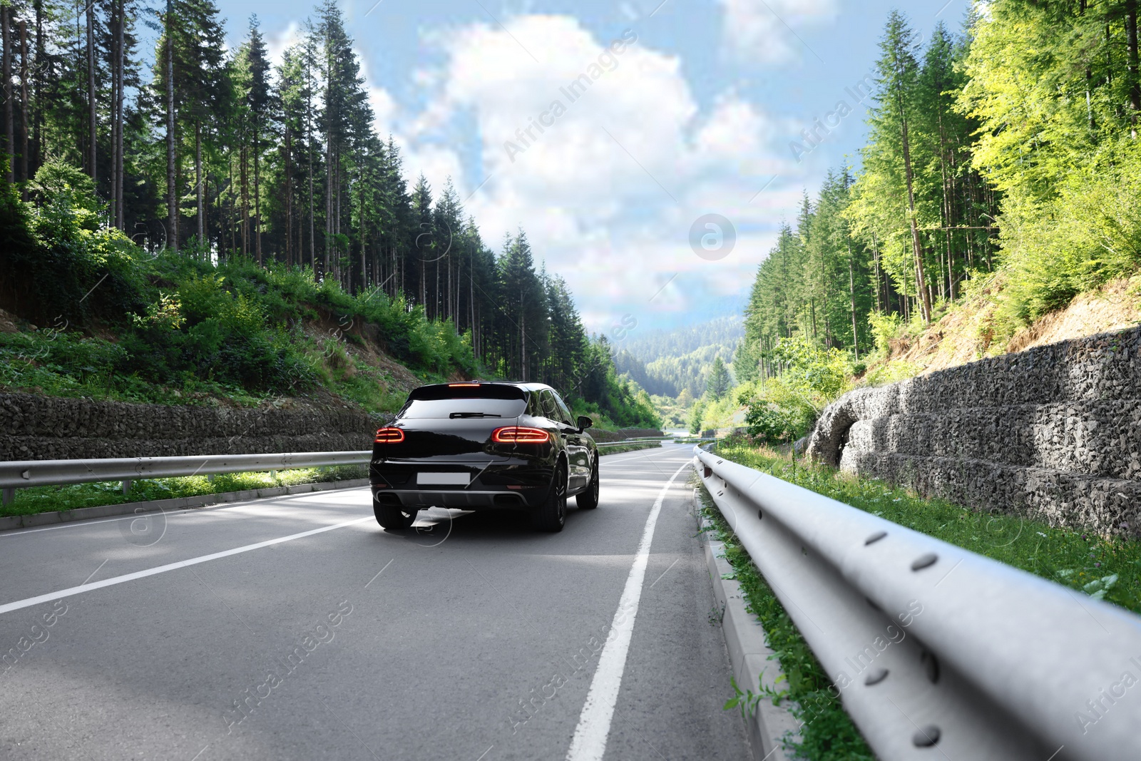 Photo of Picturesque view of asphalt road with modern car