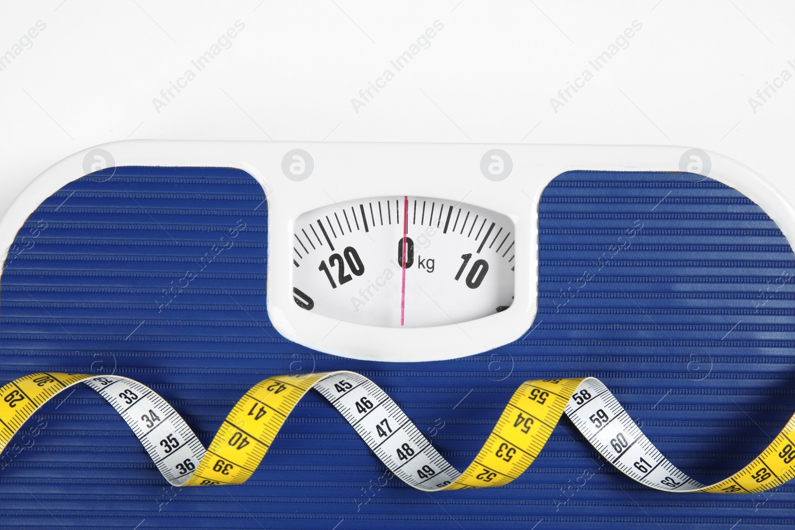 Photo of Modern scales and tape measure isolated on white, top view