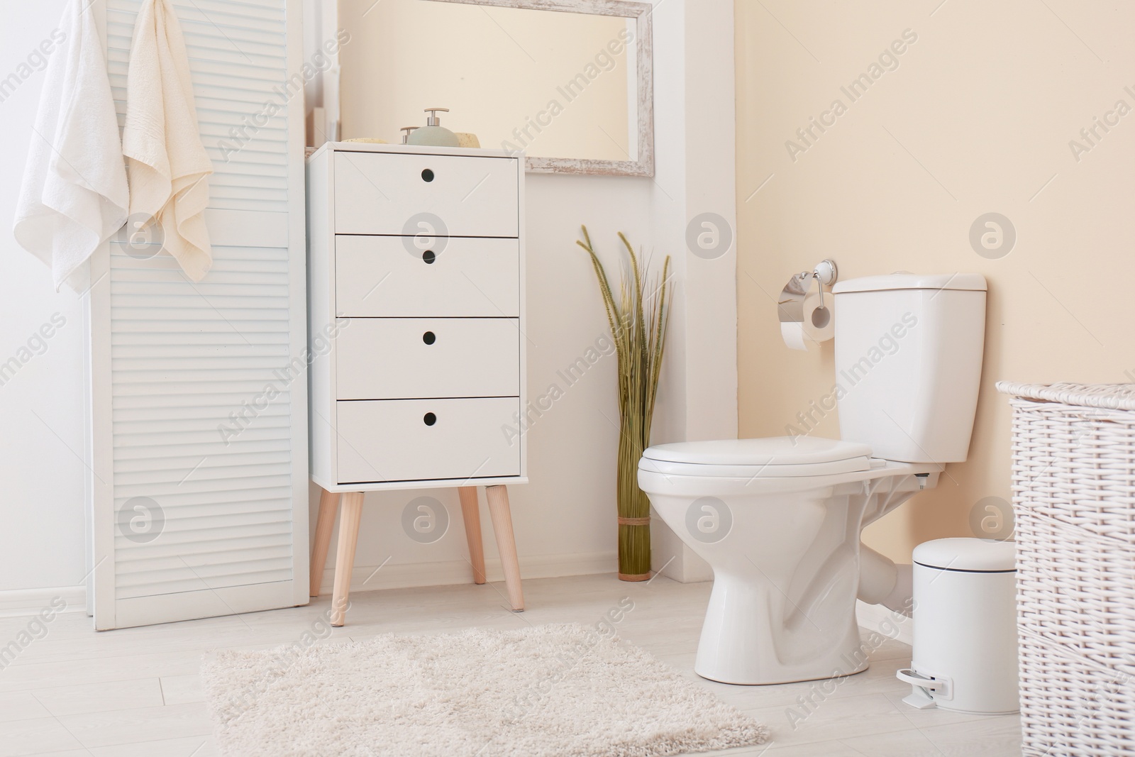 Photo of Toilet bowl in modern bathroom interior