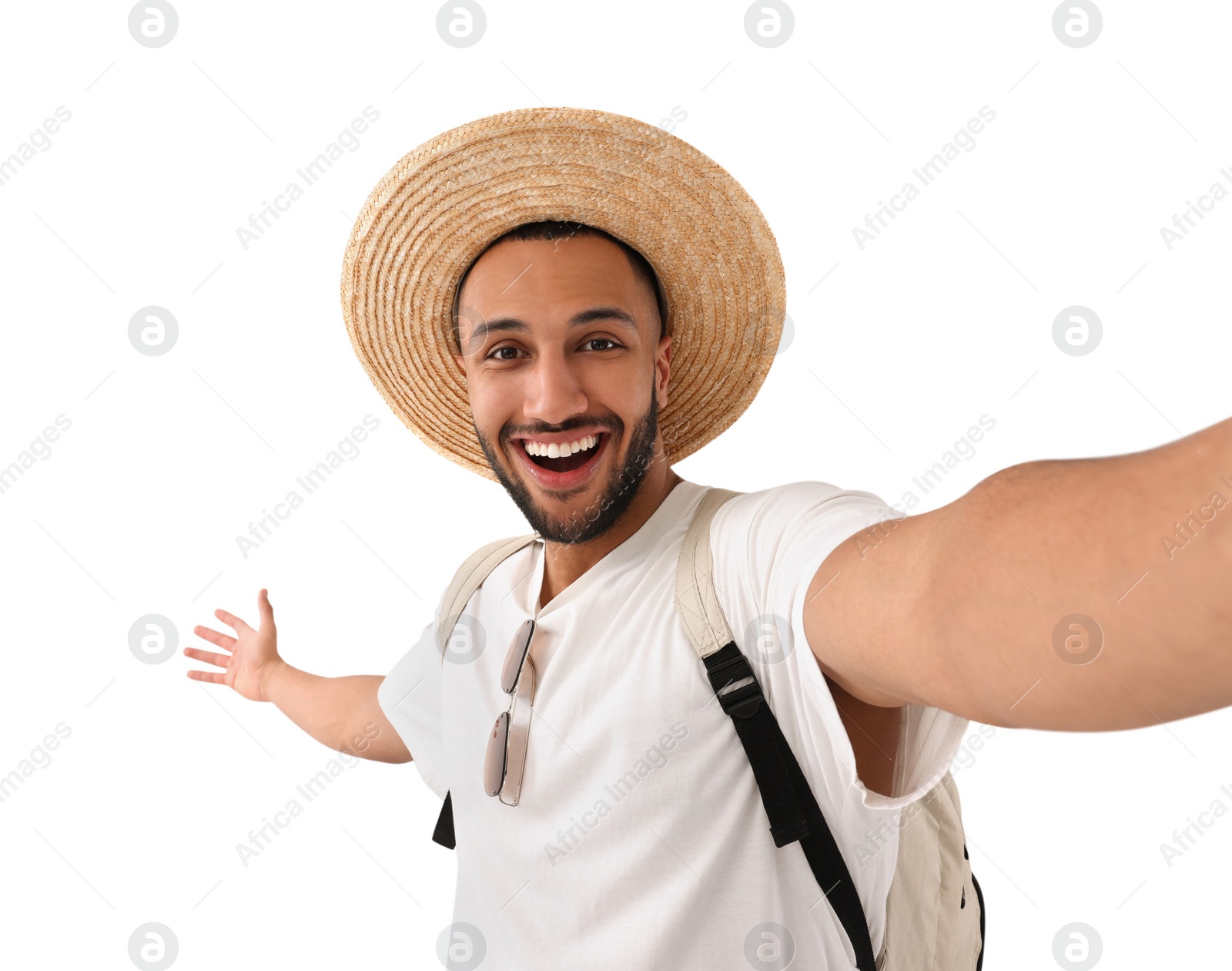 Photo of Smiling young man in straw hat taking selfie on white background